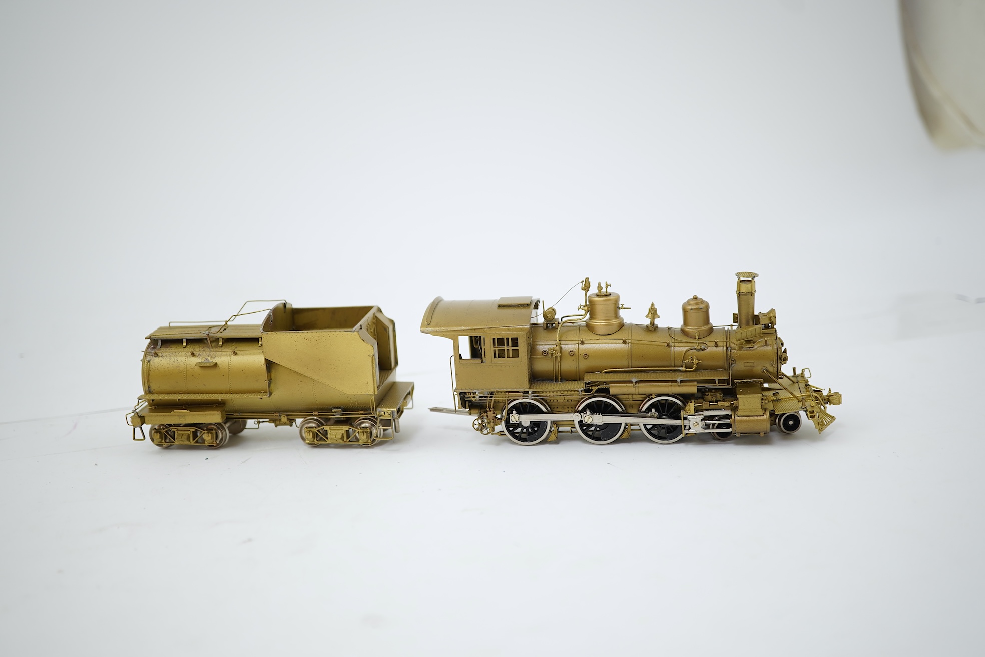 A boxed HO gauge Sunset Models unpainted brass model of Union Pacific 1242 4-6-0 locomotive with bogie tender, powered for two rail operation.